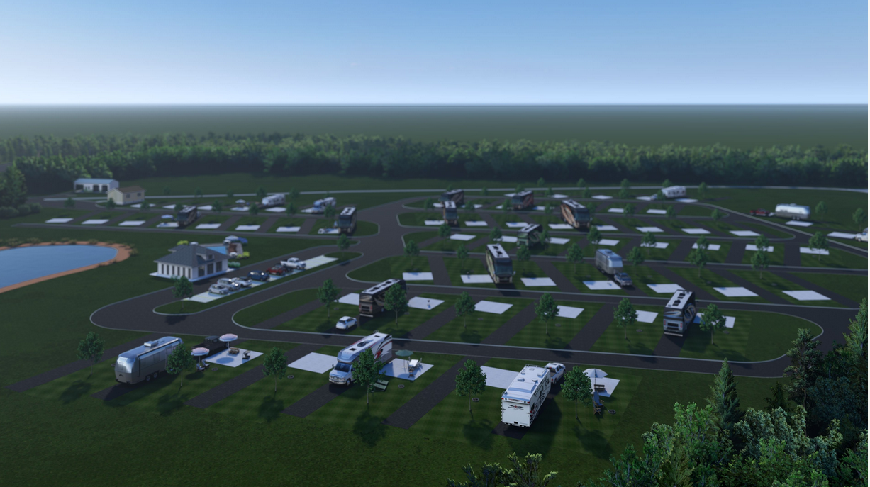 Aerial view of an RV park with multiple campers parked in designated spots, surrounded by roads, green lawns, trees, and a pond on the left.
